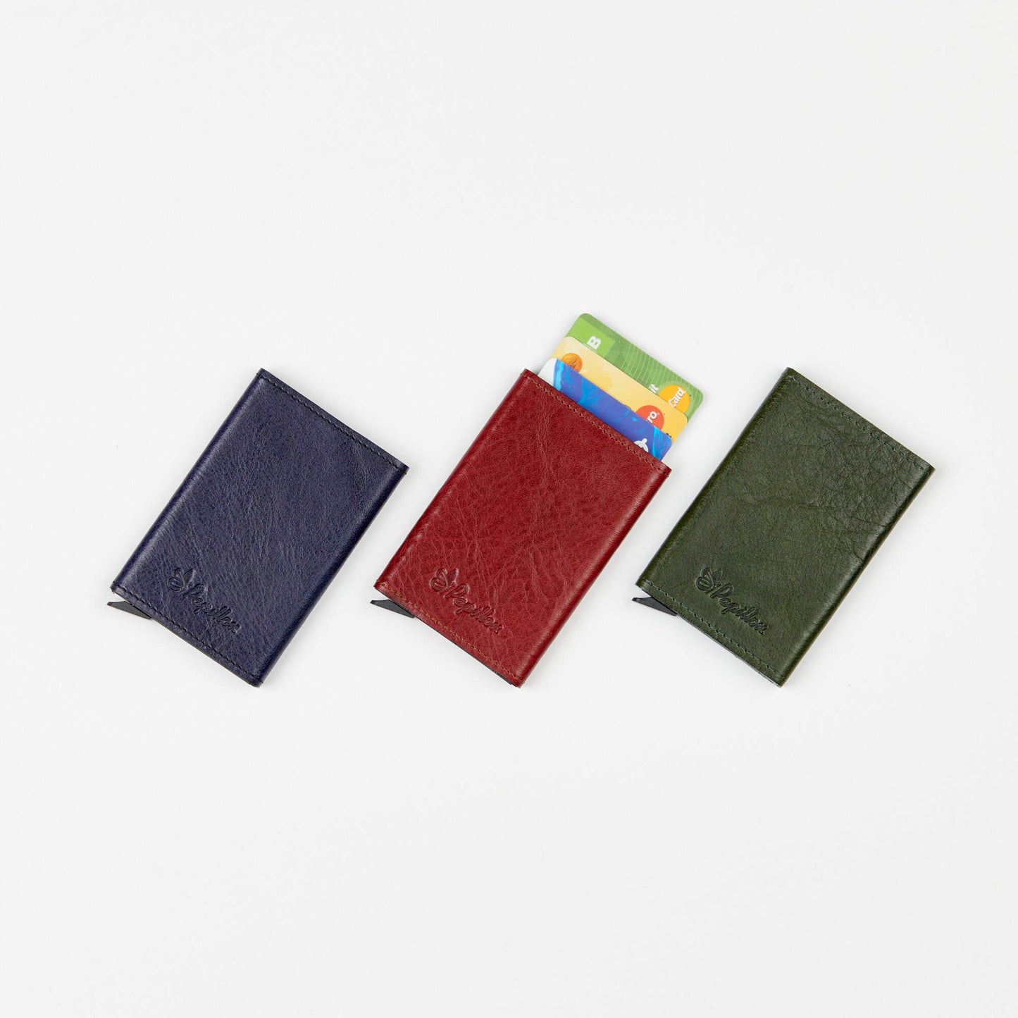 Papillon aluminum leather card holder in navy blue red and green with credit cards inside