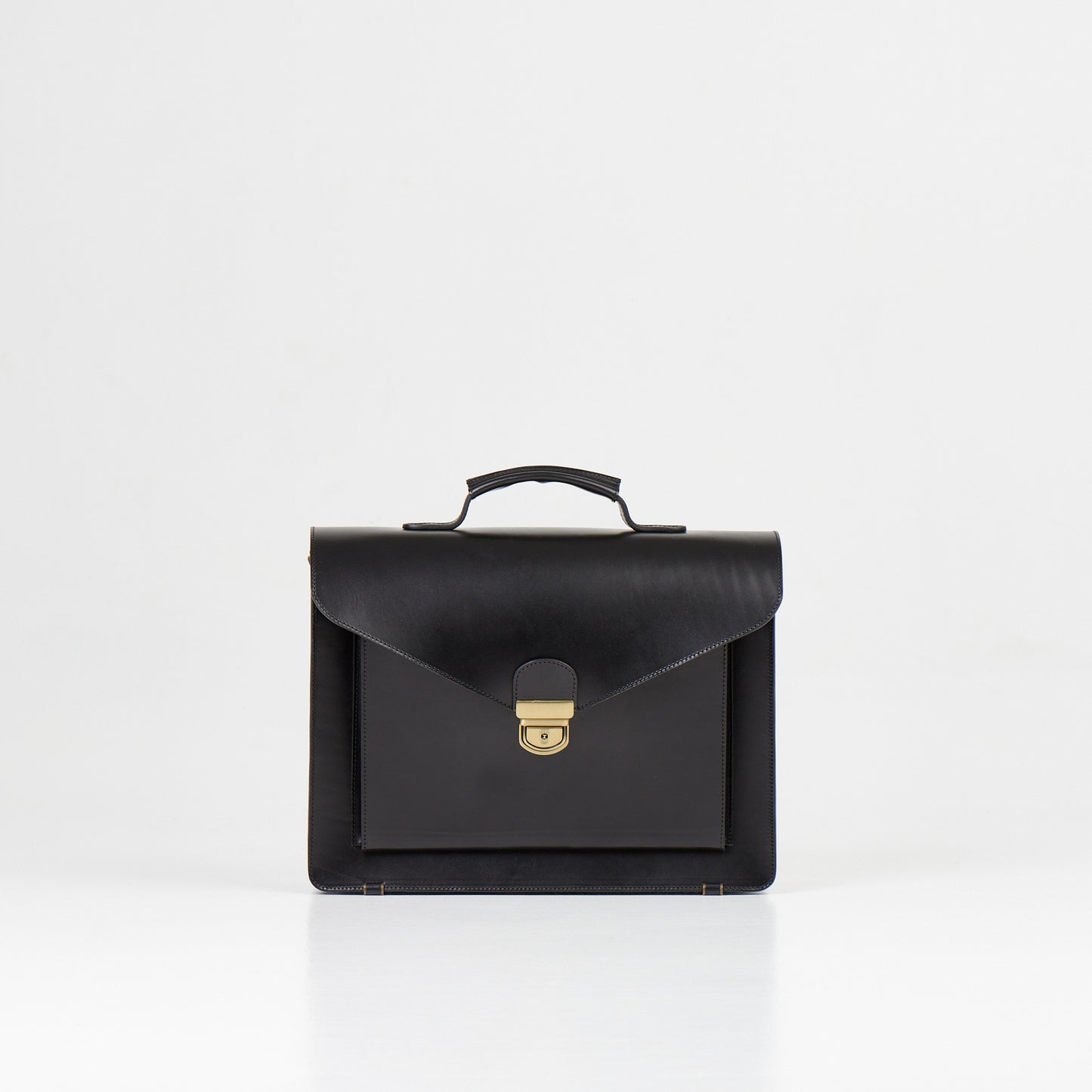 Papillon black artisan leather business bag with top handle and metal clasp closure