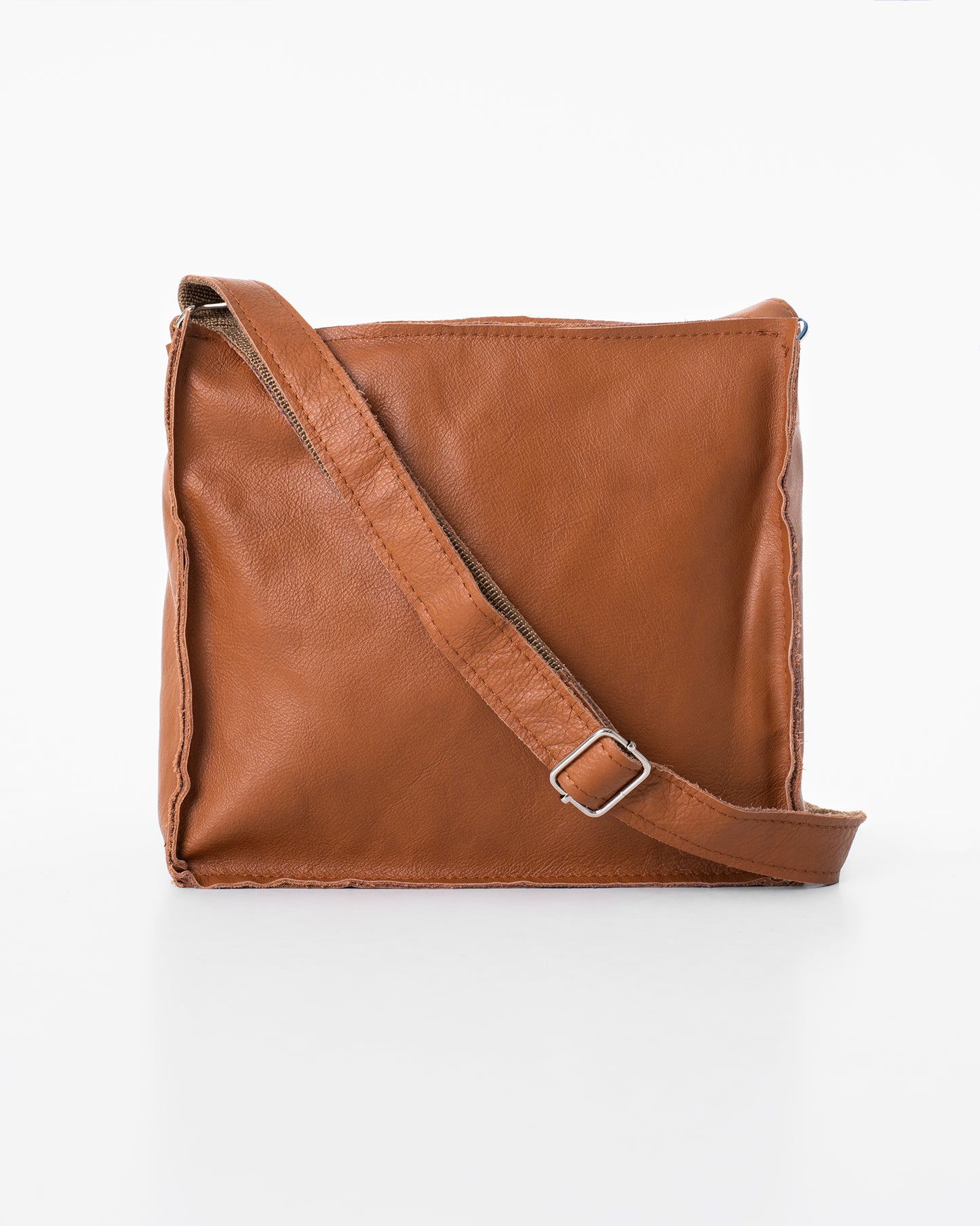 Trendbag soft leather sling bag for women in brown with adjustable strap and minimalist design