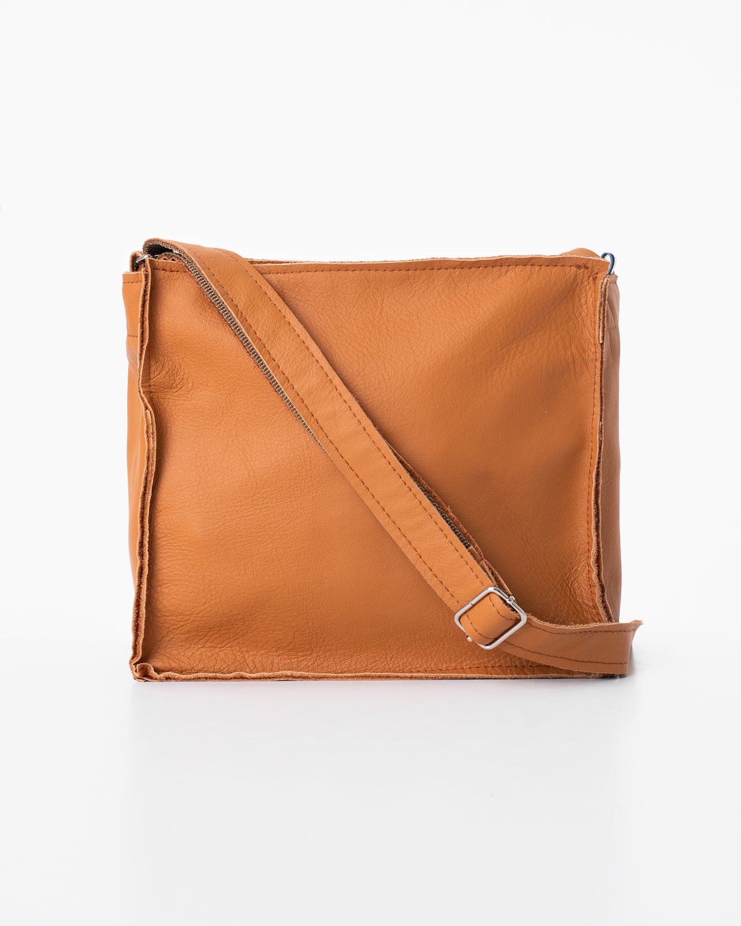 Calvados brown crossbody bag by Trendbag featuring adjustable strap and smooth leather texture