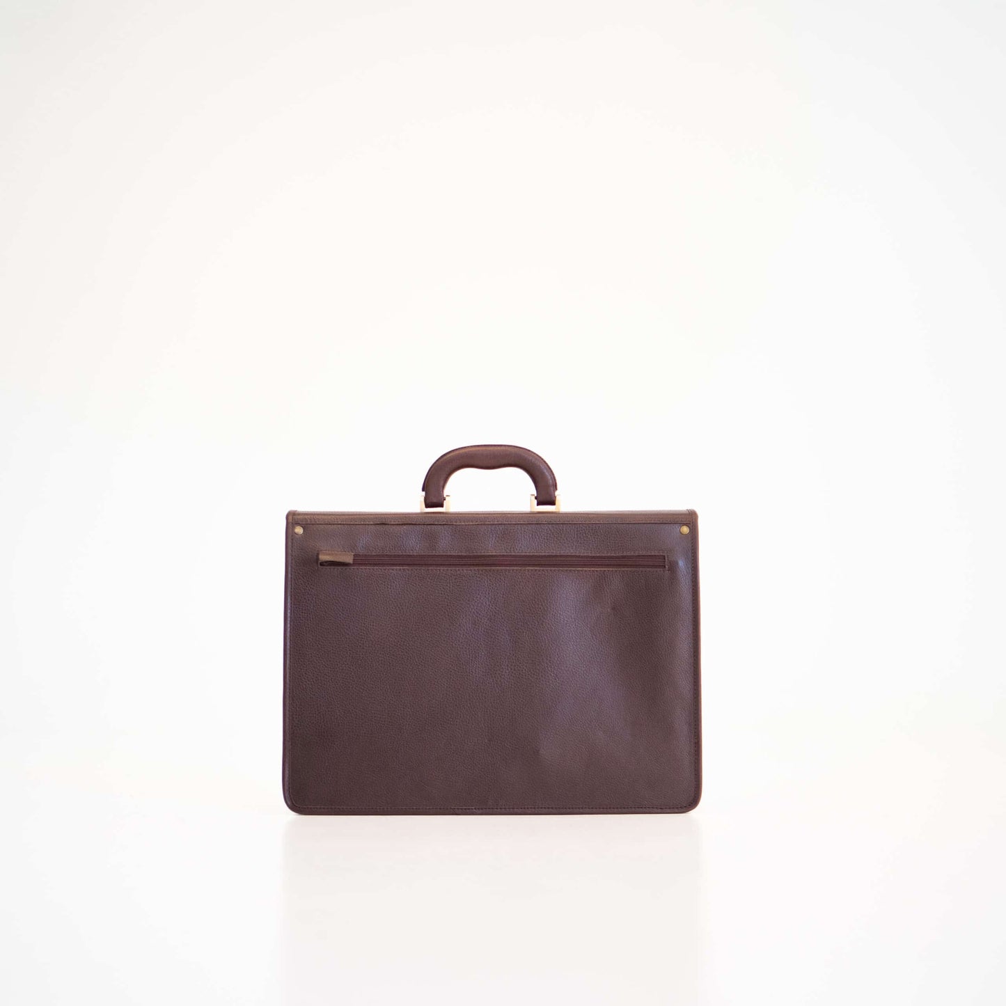 Papillon dark brown leather briefcase with top handle and zippered back pocket for professional use
