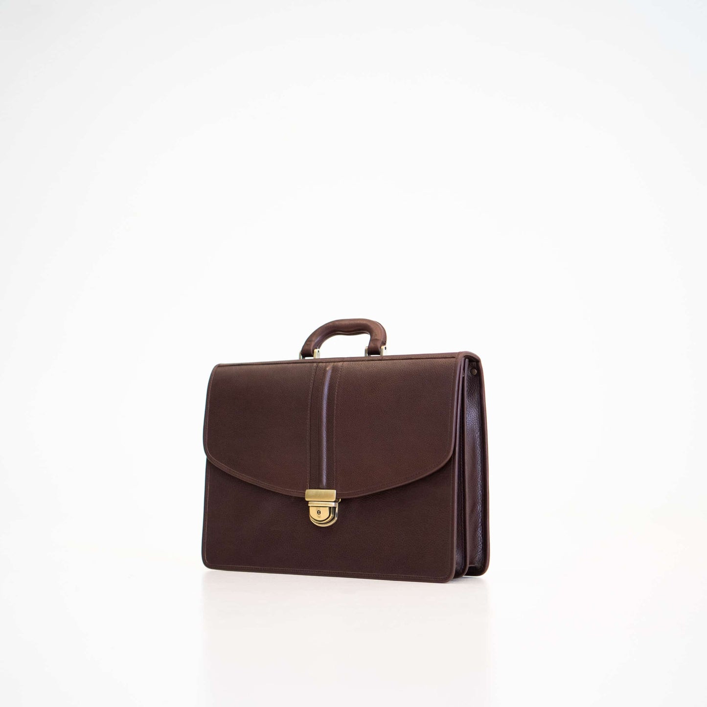 Papillon dark brown leather briefcase with top handle and gold clasp closure for professional use