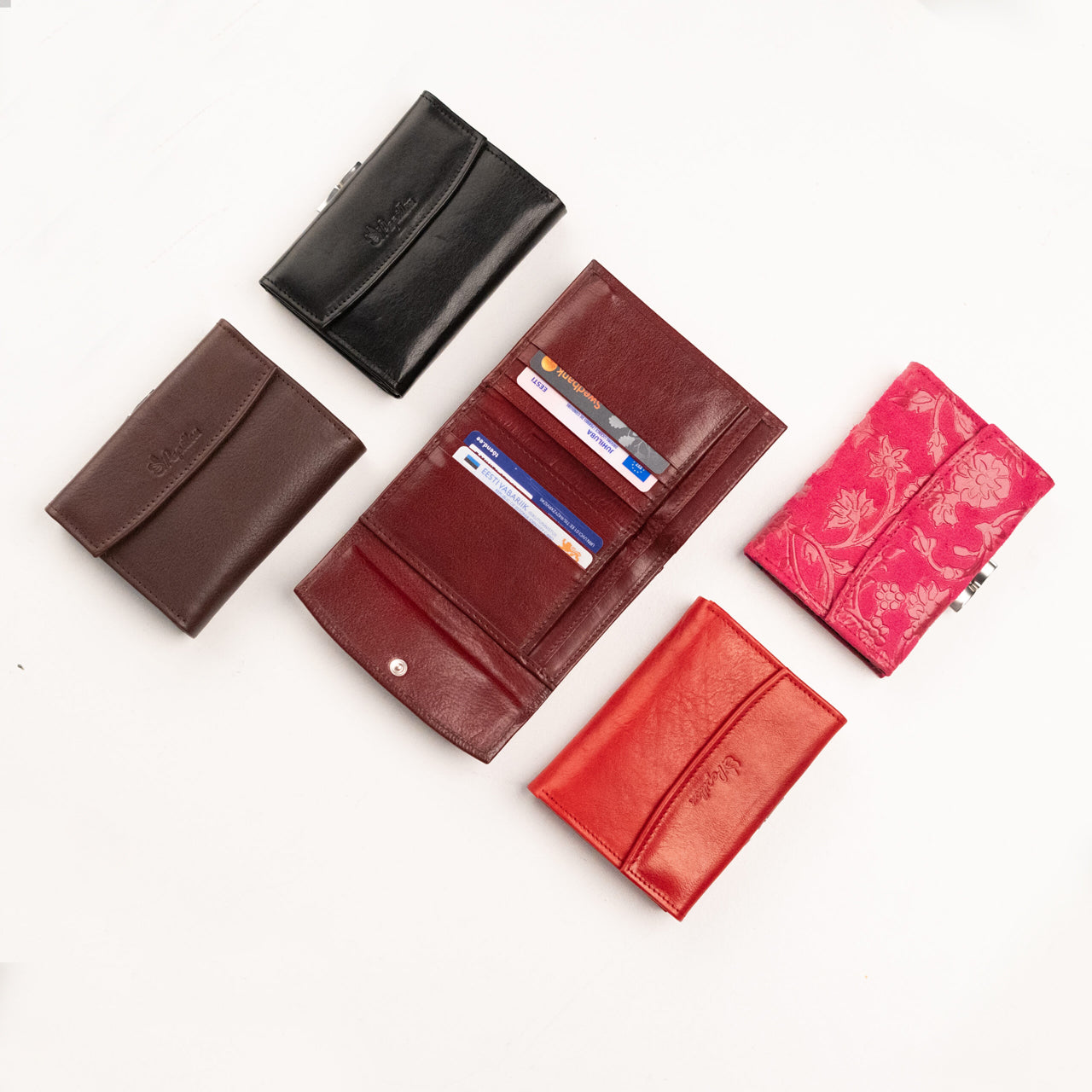 Papillon genuine leather ladies wallet collection in black, brown, red, and floral pink designs