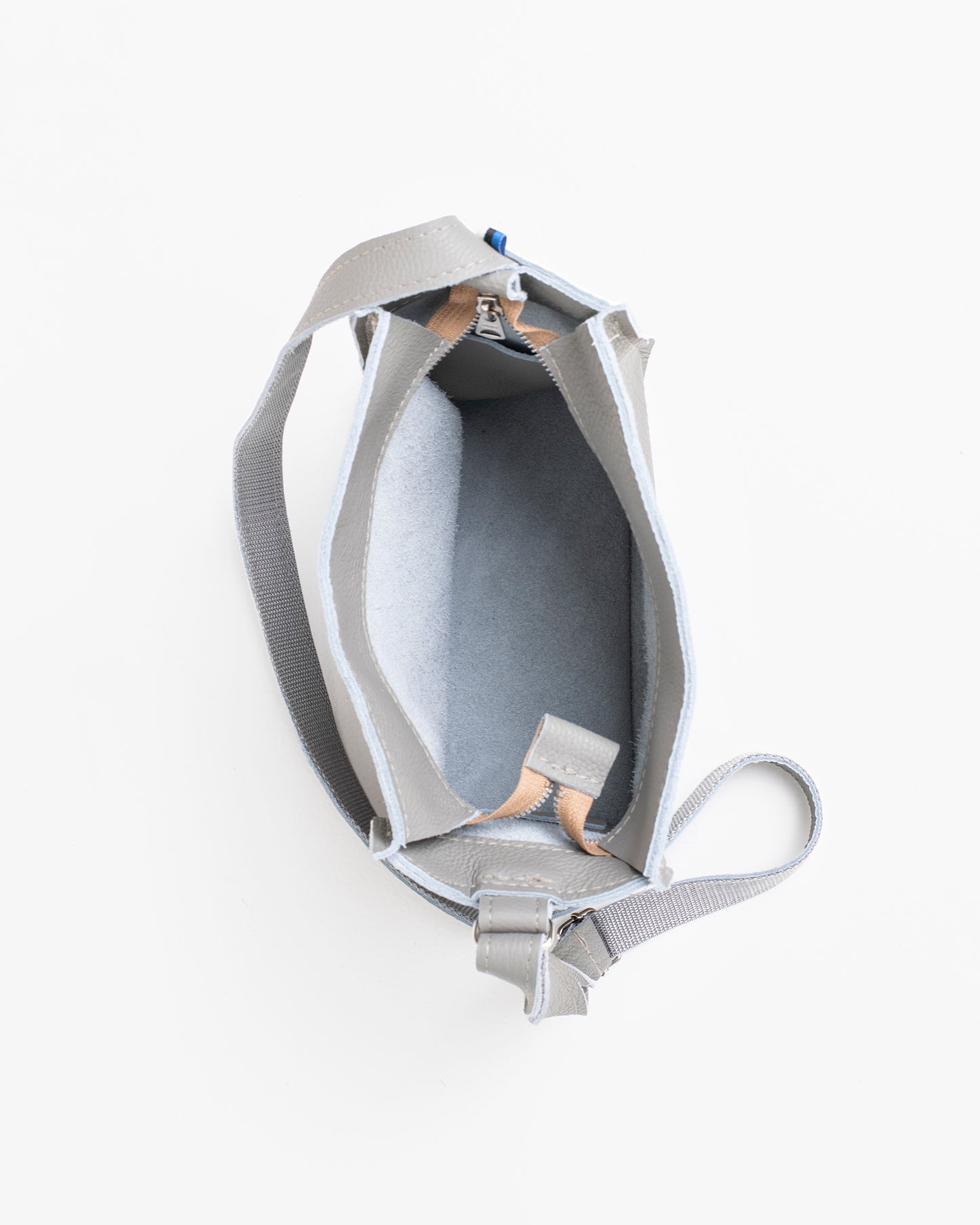 Open light grey shoulder bag showing spacious interior and adjustable strap by Trendbag
