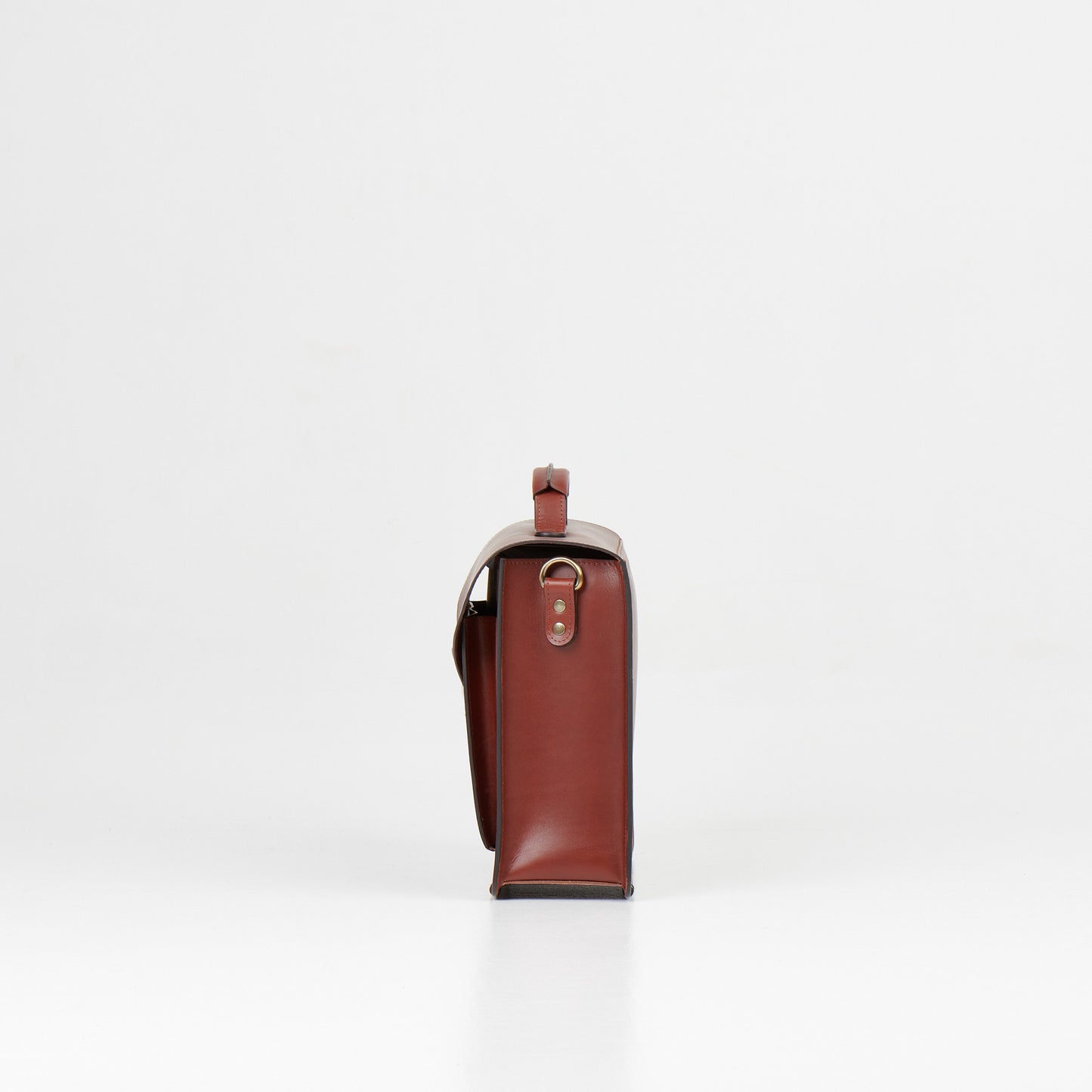 Side view of Papillon luxury leather work bag in brown with metal ring and structured design
