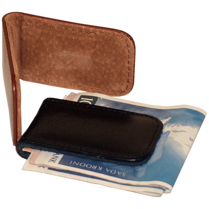 Papillon black leather magnetic money clip holding folded currency on brown suede background