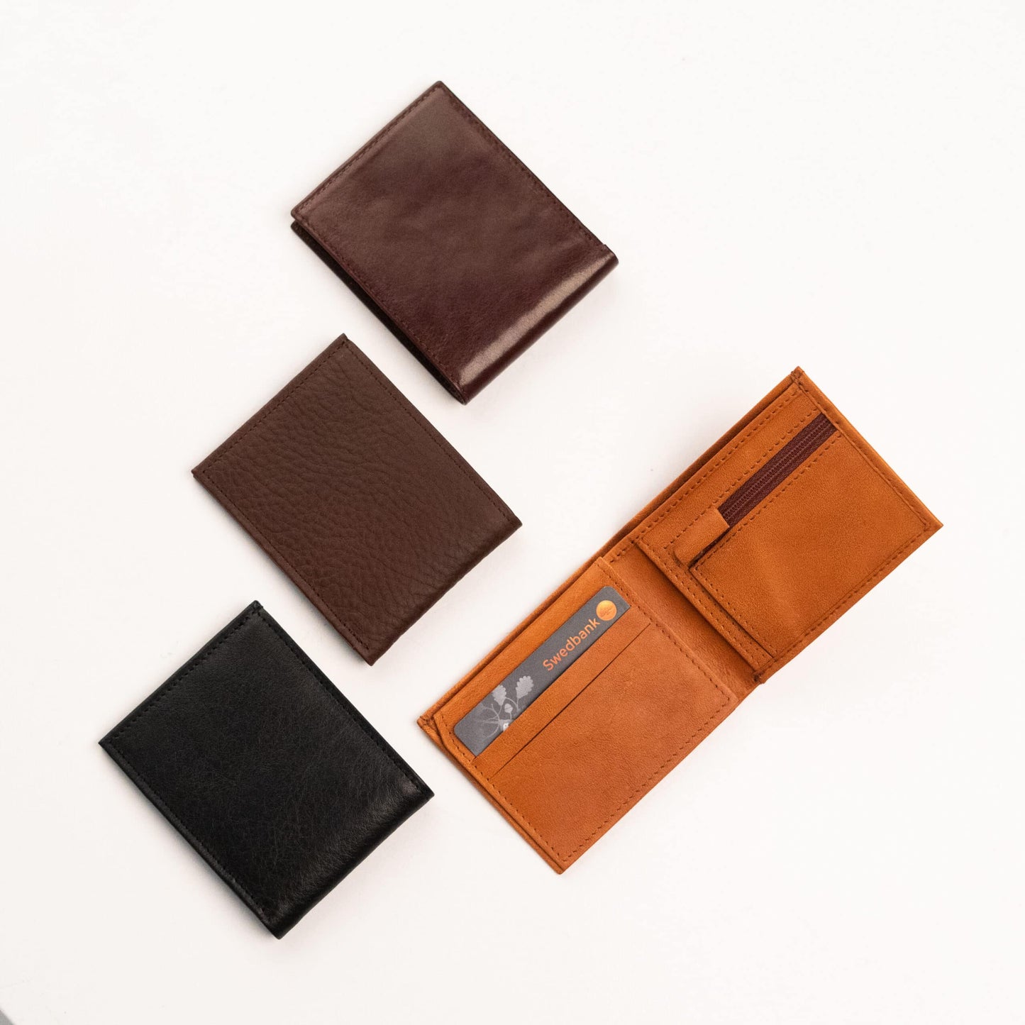 Papillon minimalist men's wallet collection in black, dark brown, and tan leather with card slots and coin pocket