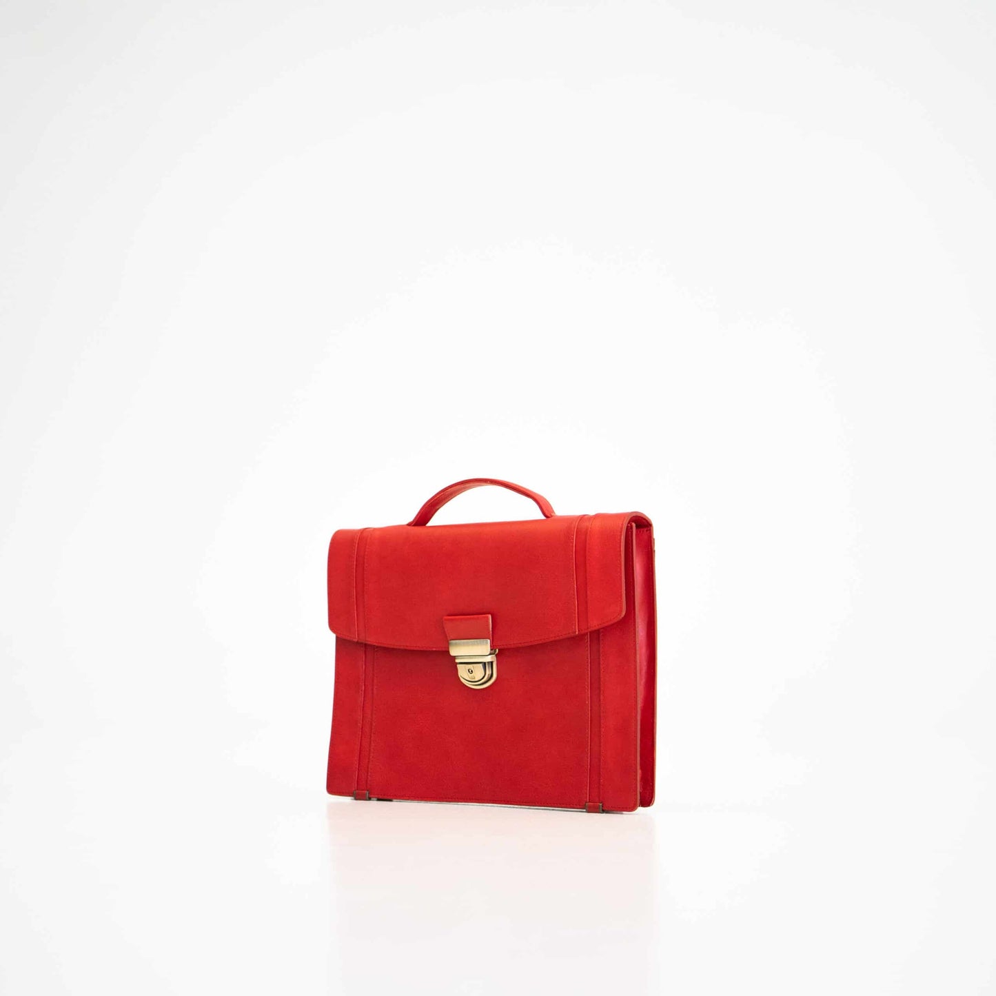Papillon modern red office bag with gold clasp and top handle on white background
