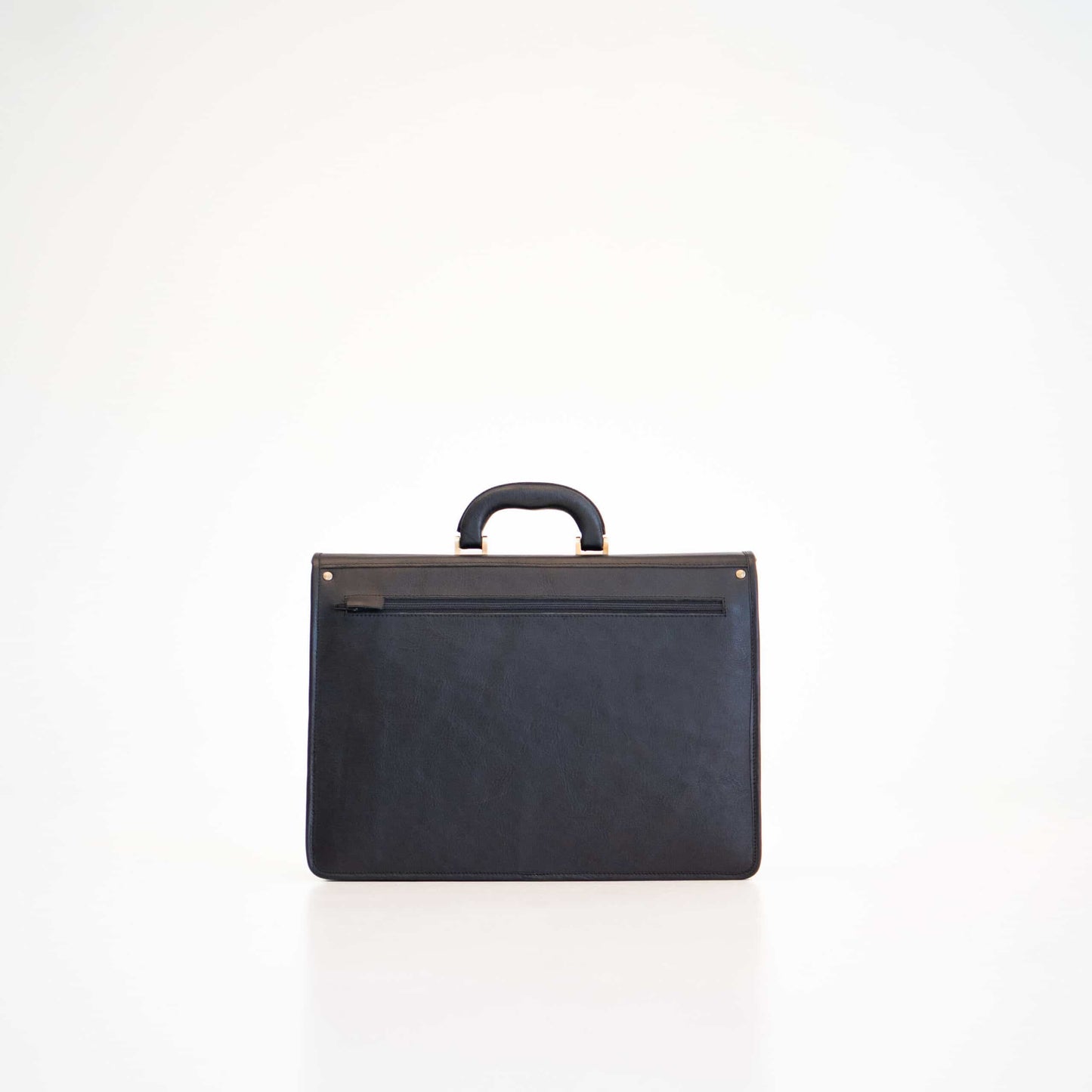 Black professional leather laptop briefcase with top handle and front zipper pocket by Papillon