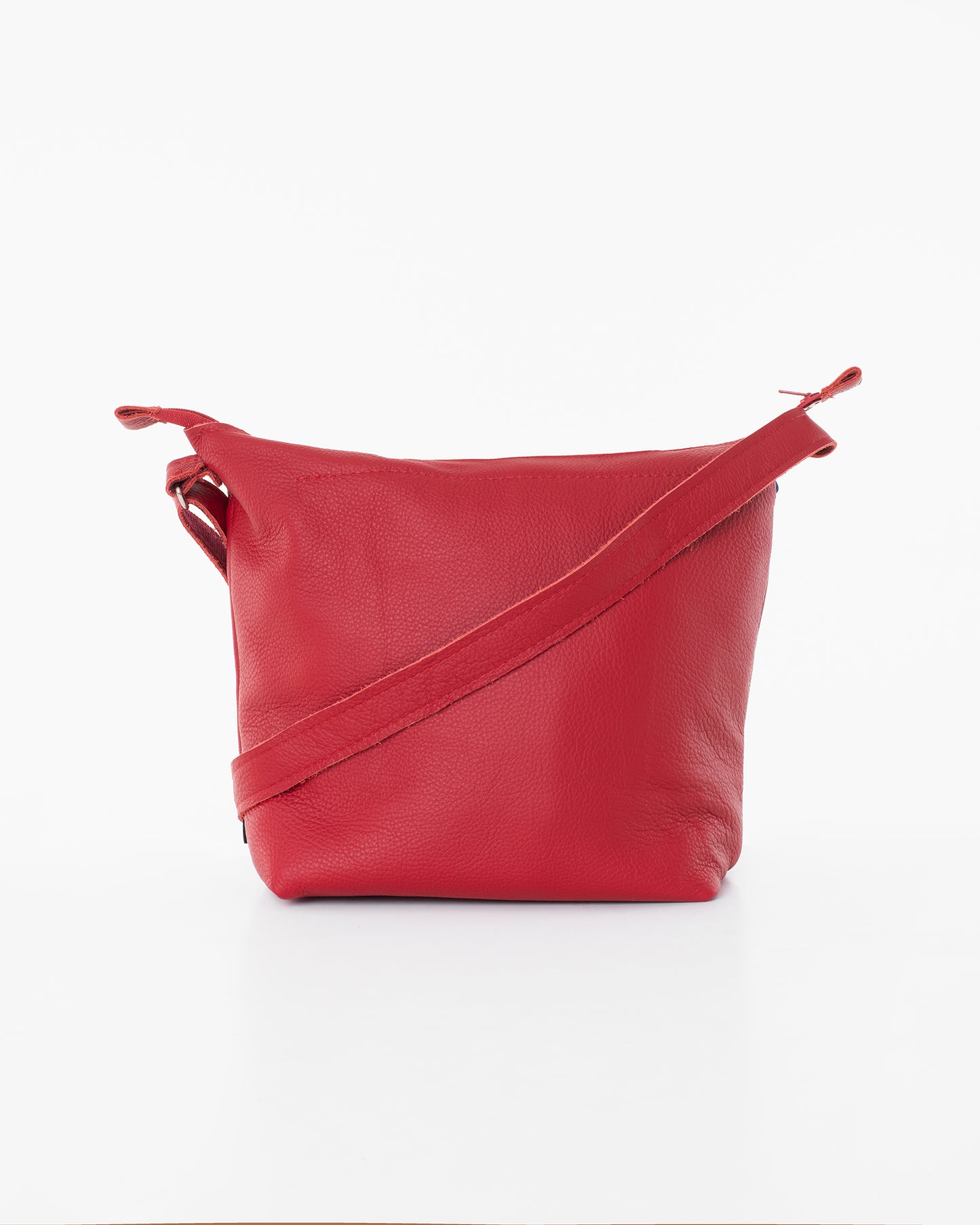 Red small crossbody bag for women by Trendbag with adjustable strap and sleek leather design