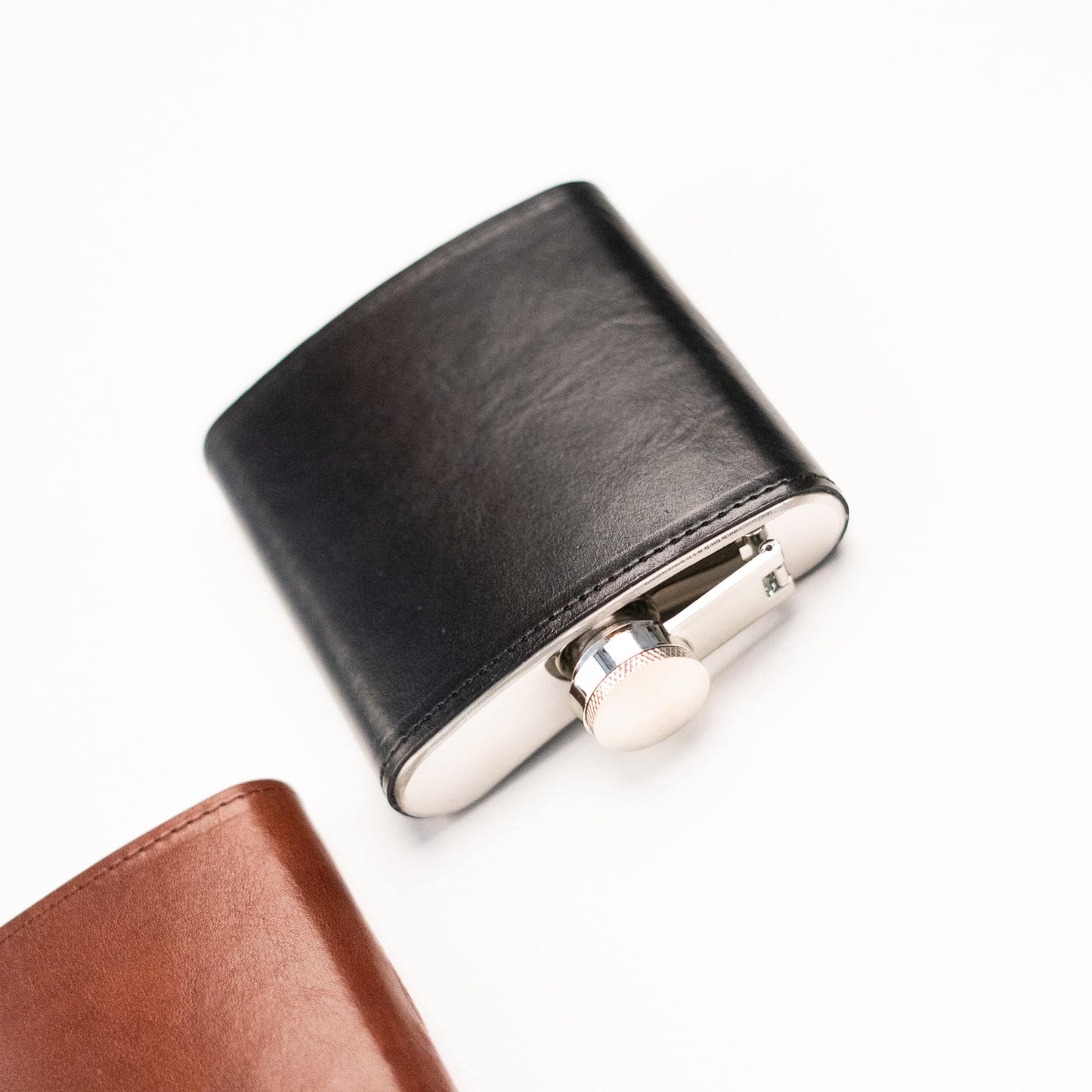 Papillon stylish pocket flask in black leather with silver cap and sleek design