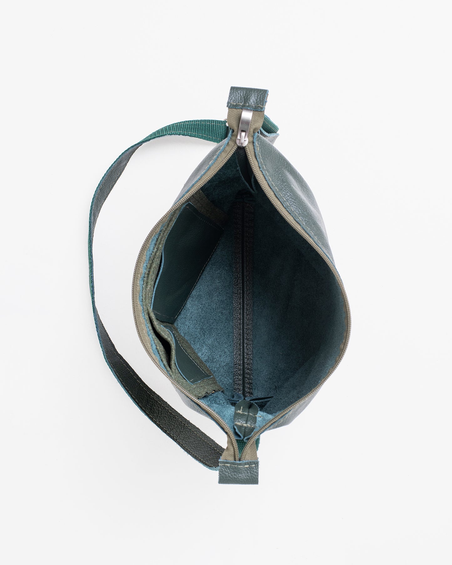 Top view of women's dark grey shoulder bag showing spacious interior and zipper pocket