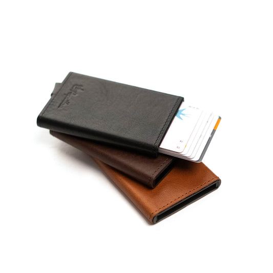 Papillon aluminum leather card holder in black brown and tan with cards partially visible