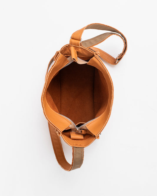Open top view of calvados brown crossbody bag with adjustable strap and zipper closure