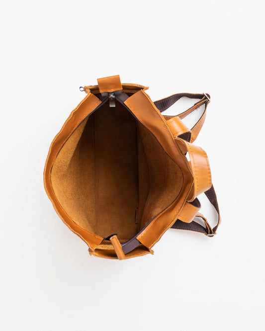 Top view of Trendbag caramel leather backpack showing spacious interior and brown straps