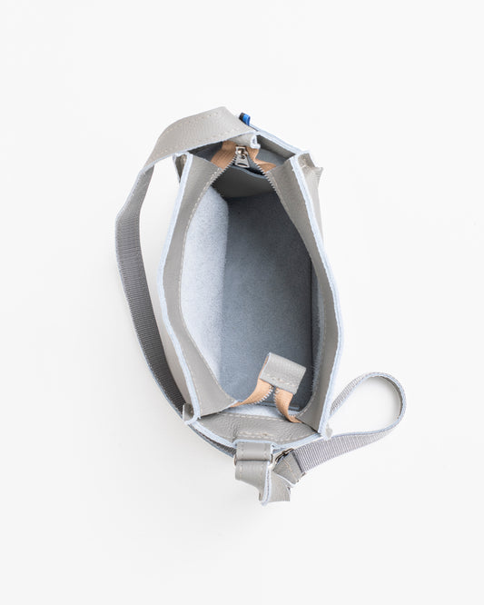 Open light grey shoulder bag showing spacious interior and adjustable strap by Trendbag
