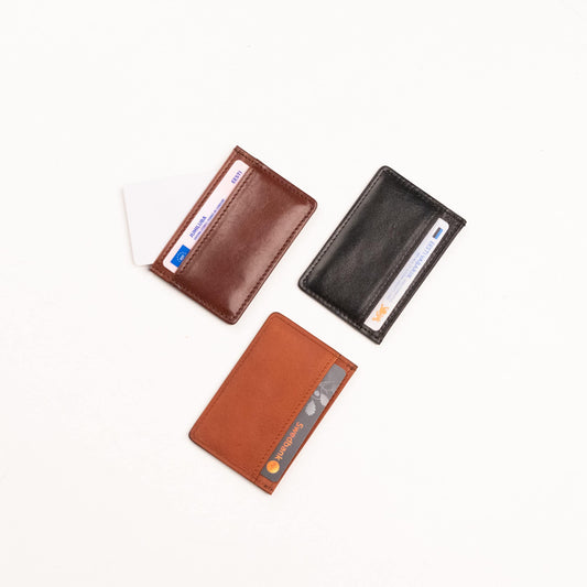 Papillon leather card holder set in brown black and tan colors with credit cards inserted
