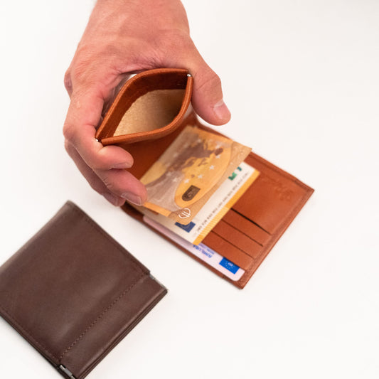 Papillon slim wallet for men in brown leather held open showing card slots and cash compartment